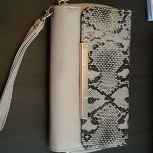 A beige snake skin wallet